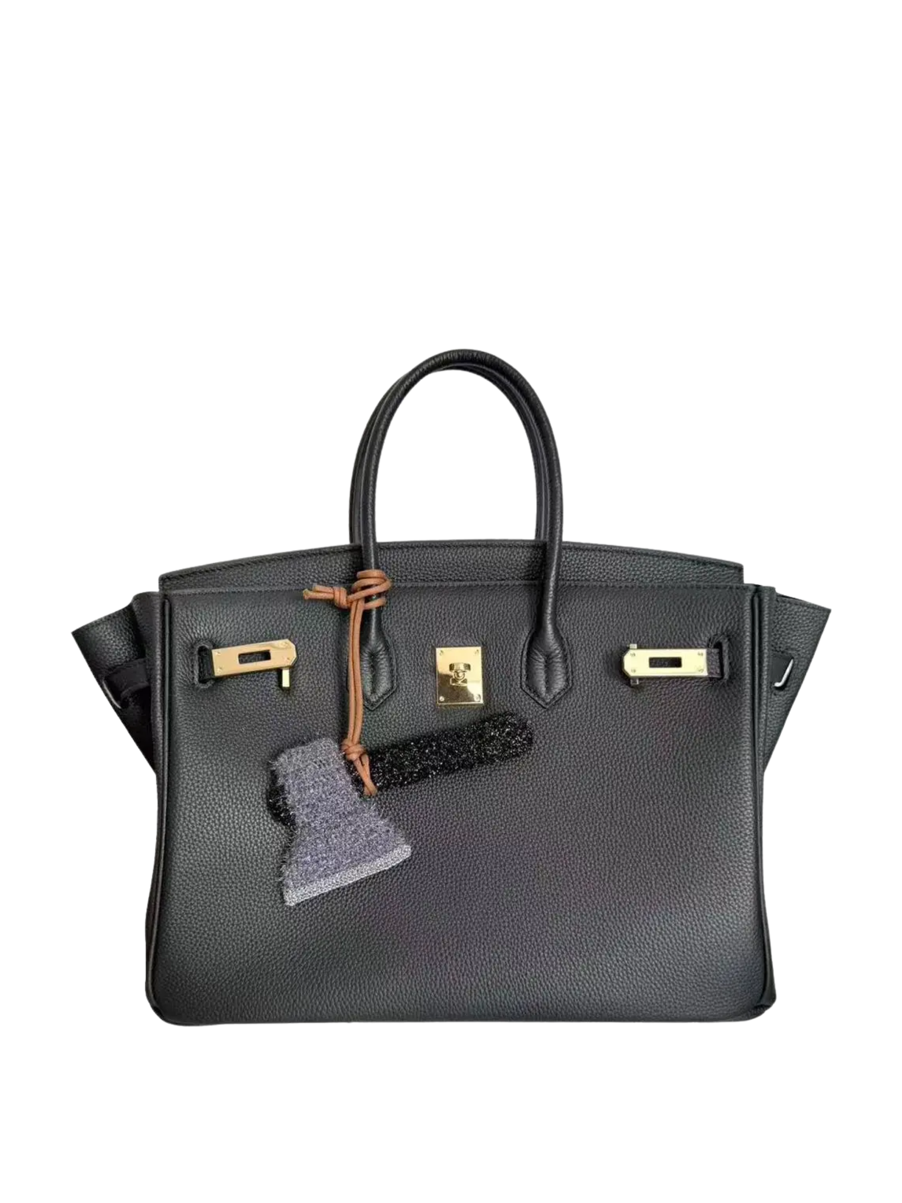 Axe bag charm styled on a handbag