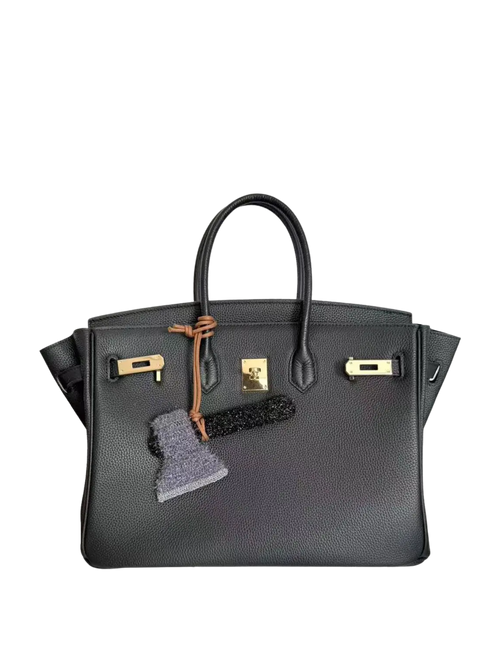 Axe bag charm styled on a handbag