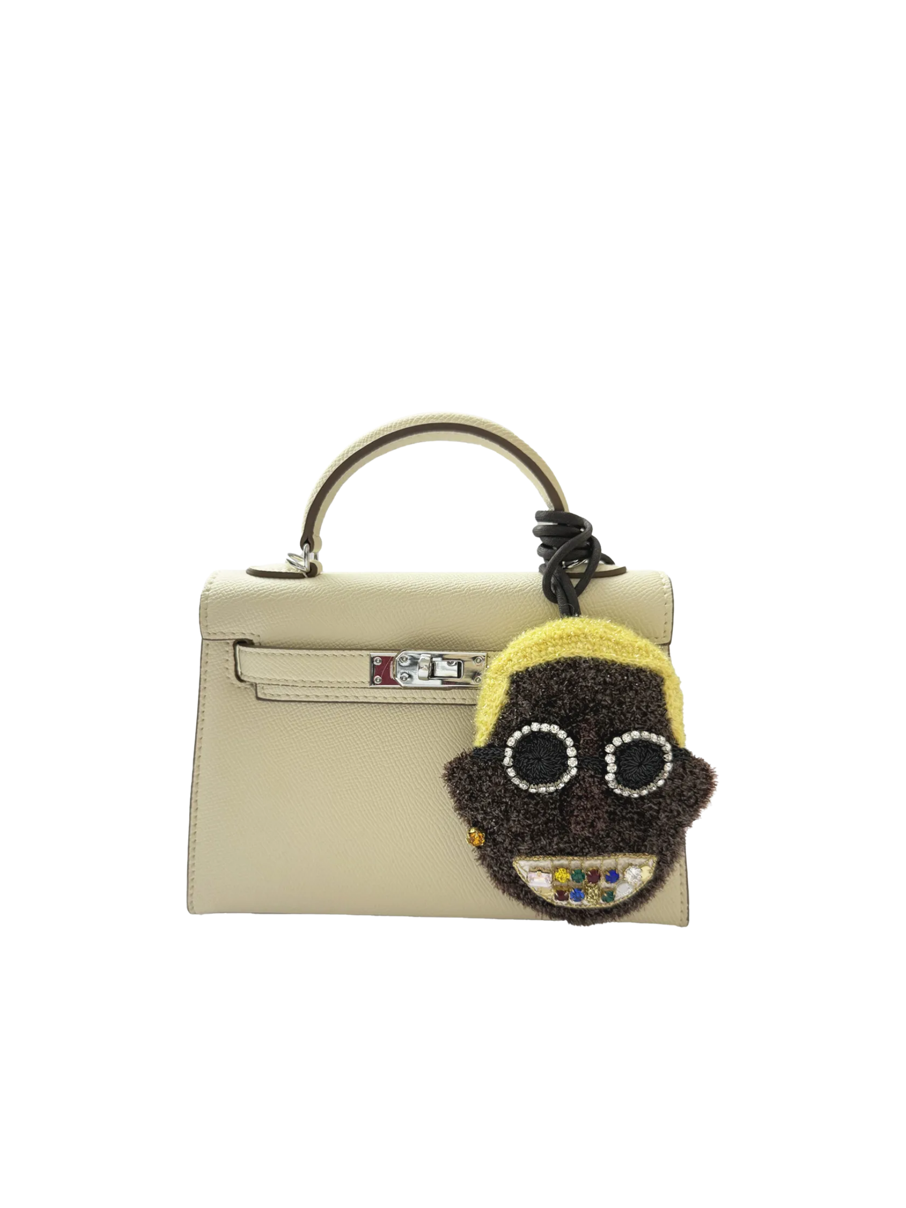 Bling Smiley bag charm styled on a handbag