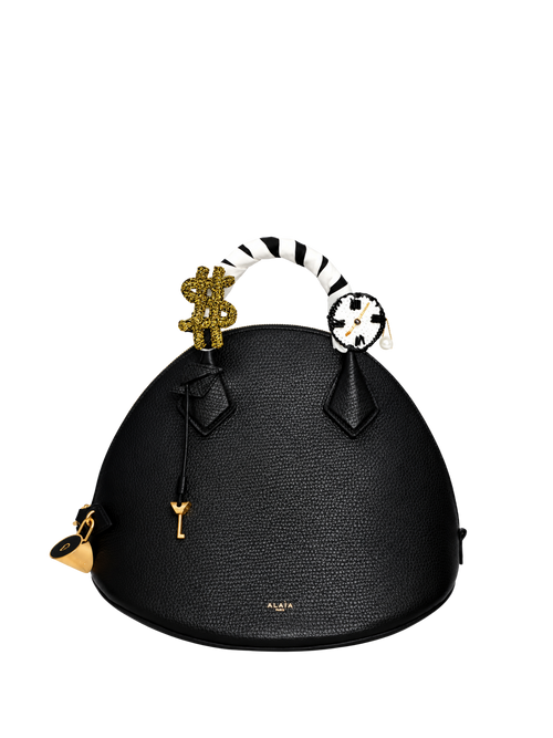 Time Money handle charm styled on a handbag